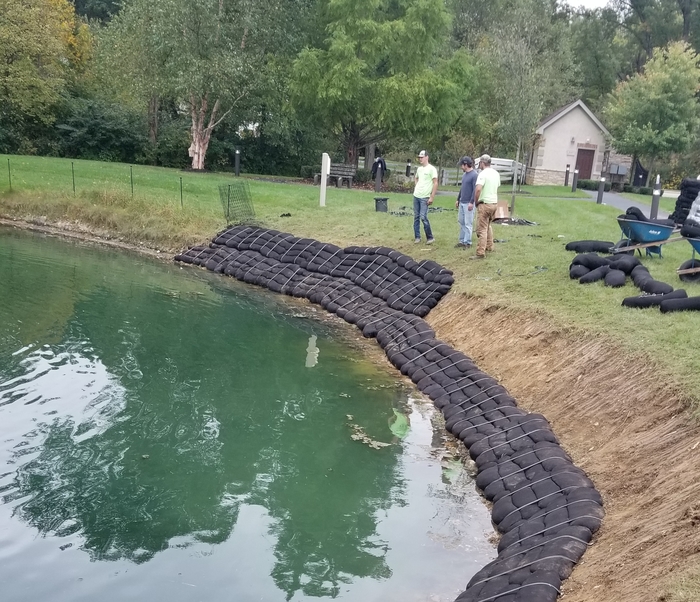 Bank stabilization in progress around pond