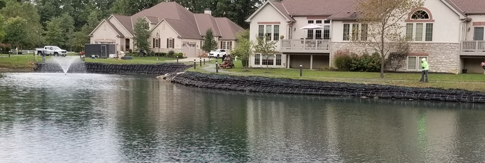 Bank stabilization blocks installed around pond